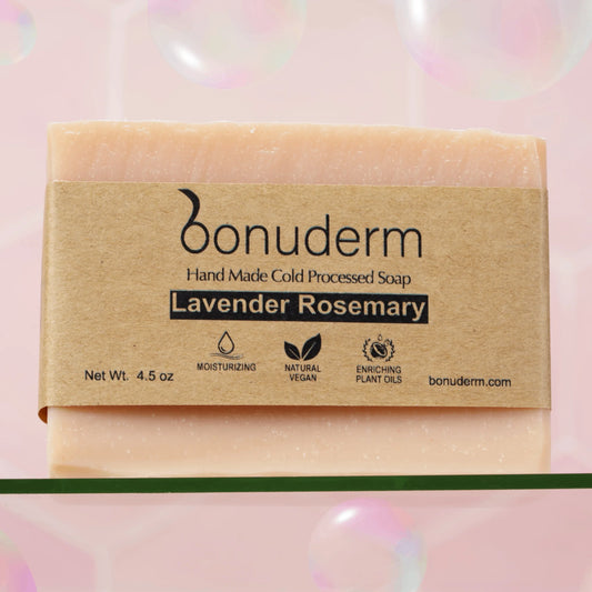 Natural Lavender Rosemary Bar of soap with 'bonuderm' packaging on a pink background