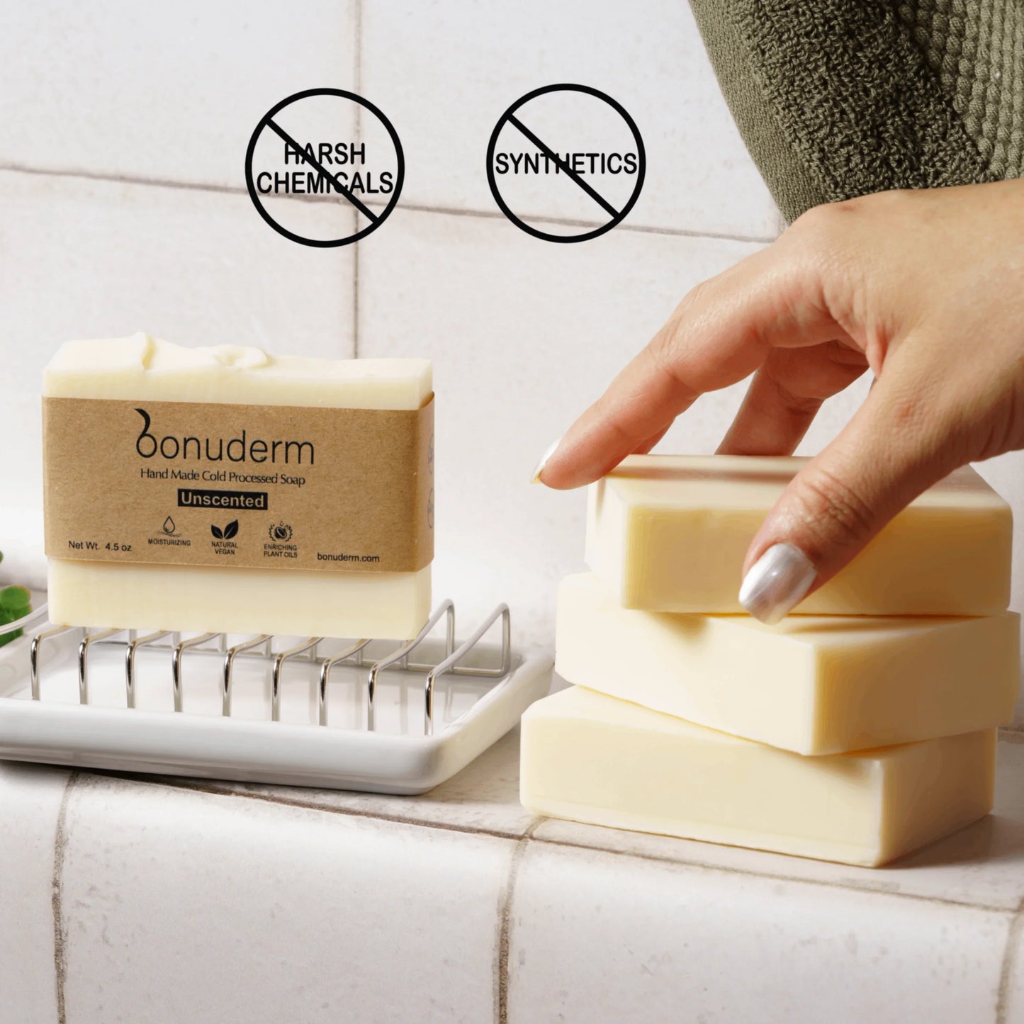 Non-fragrance body soap on a soap dish with additional natural soap bars stacked nearby. Icons above highlight “No Harsh Chemicals” and “No Synthetics.