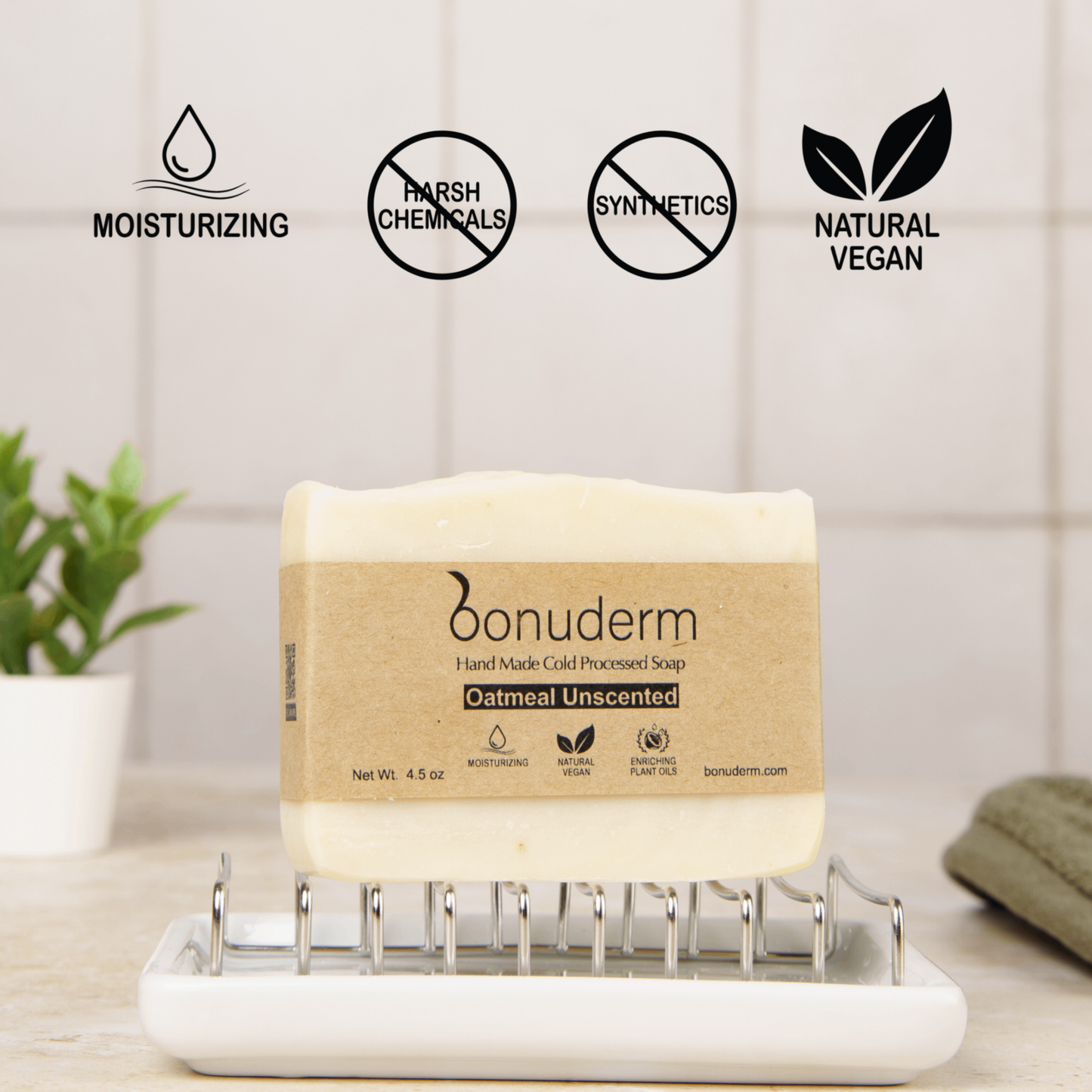 oatmeal unscented soap bar on a white tray with product features displayed: moisturizing, natural, vegan and free of harsh chemicals and synthetics.