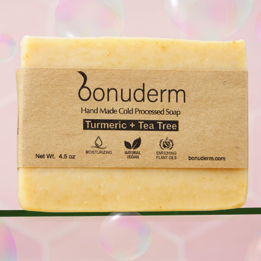 Turmeric soap with 'bonuderm' branding on a pink background