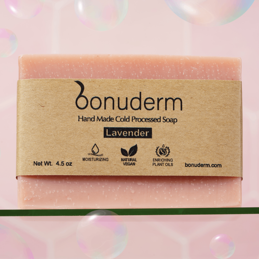 Lavender soap with 'bonuderm' label on a pink background with icons for moisturizing, vegan and natural.