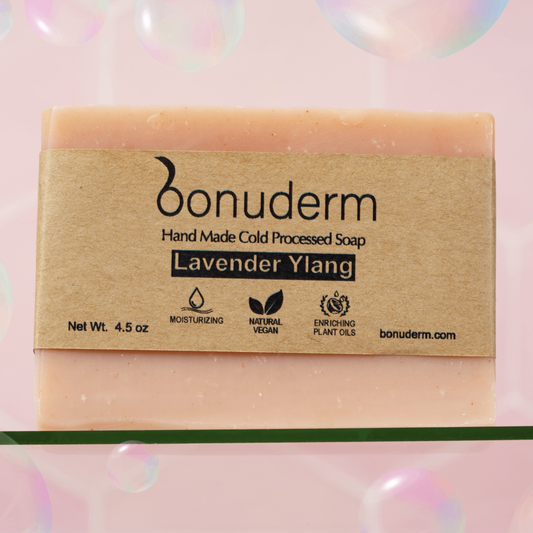Handmade lavender soap with 'bonuderm' branding on a pink background