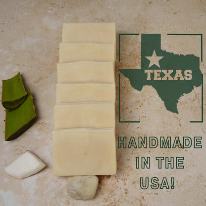 aloe vera homemade soap with aloe vera pieces on a surface with a Texas map and 'Handmade in the USA' text.
