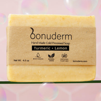lemon turmeric soap with 'bonuderm' branding on a pink background