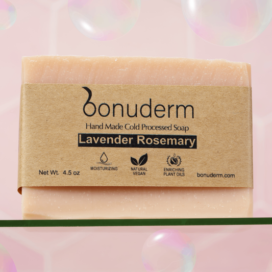 Natural Lavender Rosemary Bar of soap with 'bonuderm' packaging on a pink background