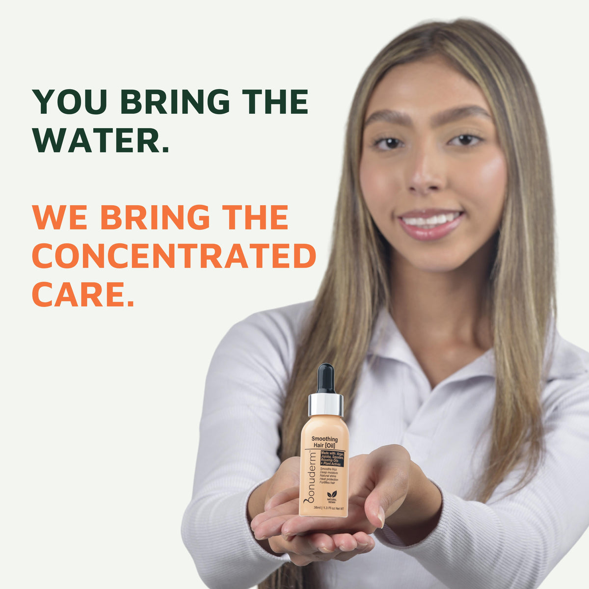 a woman holding a bonuderm shine hair oil bottle with texts : "you bring the water. We bring the concentrated care."