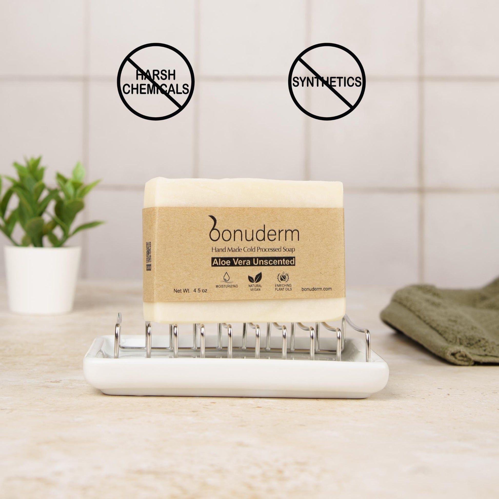 soap aloe on a white tray with 'Bonuderm' branding, surrounded by natural elements.