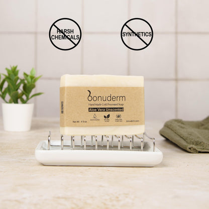 soap aloe on a white tray with 'Bonuderm' branding, surrounded by natural elements.